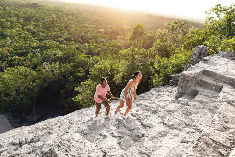 RCI_Cozumel_Coba_Ruins_CoupleClimbing_05870_RET_CMYK_C